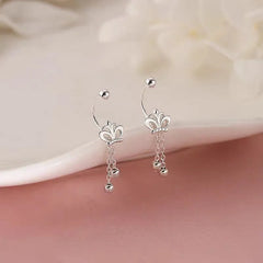 Model showcasing the dangle and style of the Sterling Silver Crown Tassel Screw Earrings