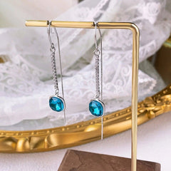 Model showcasing the dangle and style of the Sterling Silver Crystal Diamond Threader Earrings