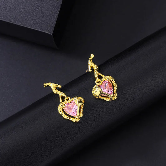 Model showcasing the dangle and style of the Sterling Silver Crystal Pink Heart Earrings