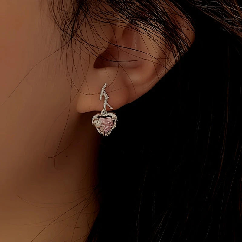 Angled view of the Sterling Silver Crystal Pink Heart Earrings