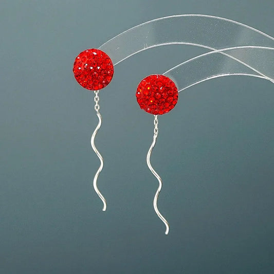 Model showcasing the dangle and style of the Sterling Silver Crystal Wavy Line Threader Earrings