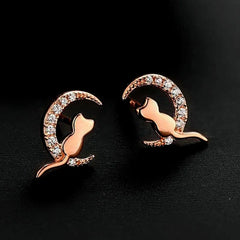Model showcasing the dangle and style of the Sterling Silver Cute Cat And Moon Stud Earrings