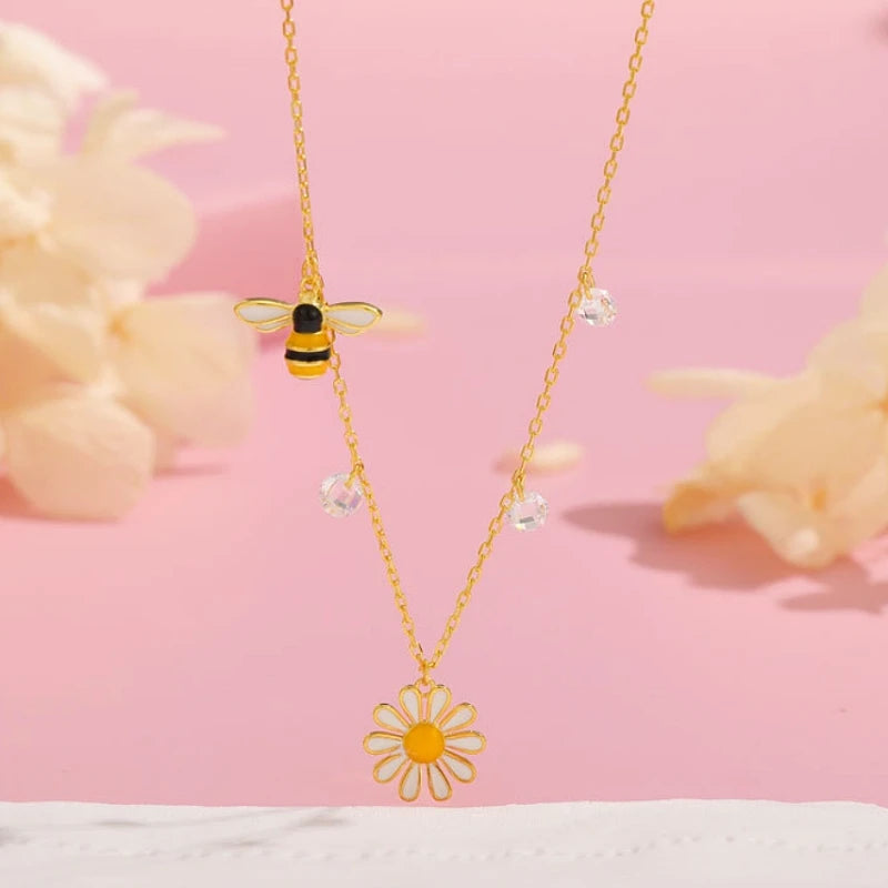 Close-up of the pendant and clasp on the Sunflower Bee Necklace