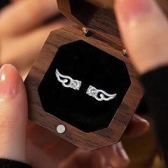 Angled view of the Sterling Silver Diamond Angel Wing Earrings