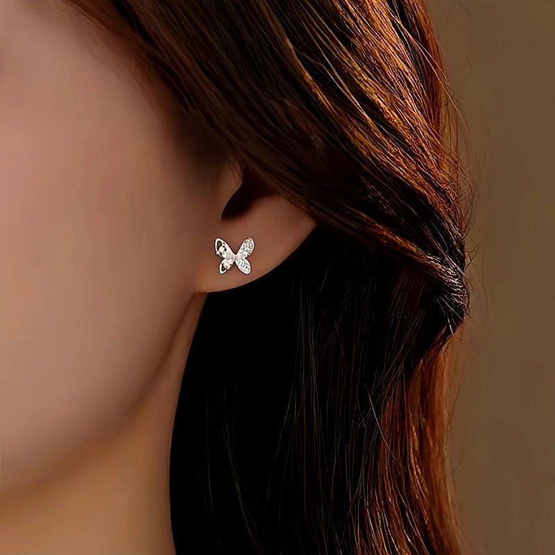Model showcasing the dangle and style of the Sterling Silver Diamond Butterfly Studs