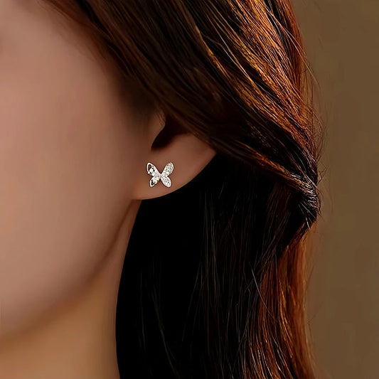 Model showcasing the dangle and style of the Sterling Silver Diamond Butterfly Studs