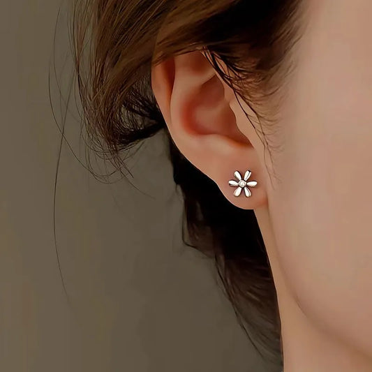 Model showcasing the dangle and style of the Sterling Silver Diamond Daisy Stud Earrings