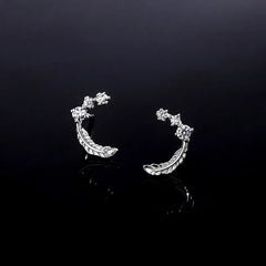 Model showcasing the dangle and style of the Sterling Silver Diamond Feather Stud Earrings