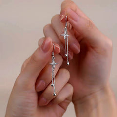 Angled view of the Sterling Silver Diamond Four-Pointed Star Bamboo Tassel Ear Hooks