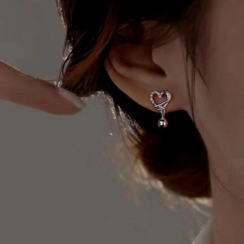 Close-up detail of the sparkling zircons and plating on the Elk Heart Necklace