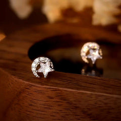Angled view of the Sterling Silver Diamond Moon And Star Stud Earrings