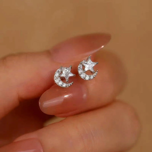 Model showcasing the dangle and style of the Sterling Silver Diamond Moon And Star Stud Earrings