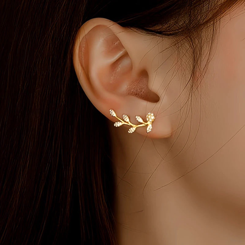 Angled view of the Sterling Silver Diamond Olive Branch Earrings