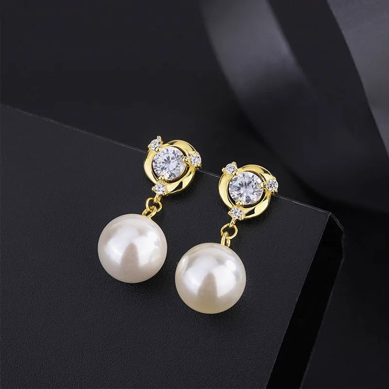 Angled view of the Sterling Silver Diamond Pearl Earrings