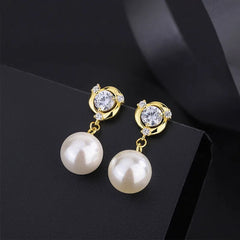 Angled view of the Sterling Silver Diamond Pearl Earrings