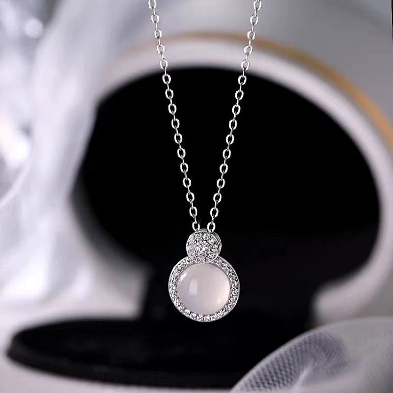 Detailed view of the Sterling Silver Diamond Round Gourd Necklaces chain and pendant