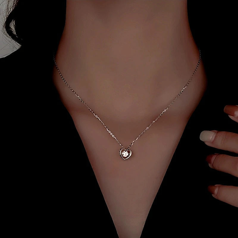 Sterling Silver Diamond Snake Heart Earrings worn to showcase its length and pendant detail