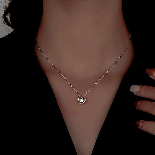 Sterling Silver Diamond Snake Heart Earrings worn to showcase its length and pendant detail