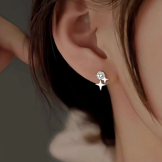 Model showcasing the dangle and style of the Sterling Silver Diamond Star Stud Earrings