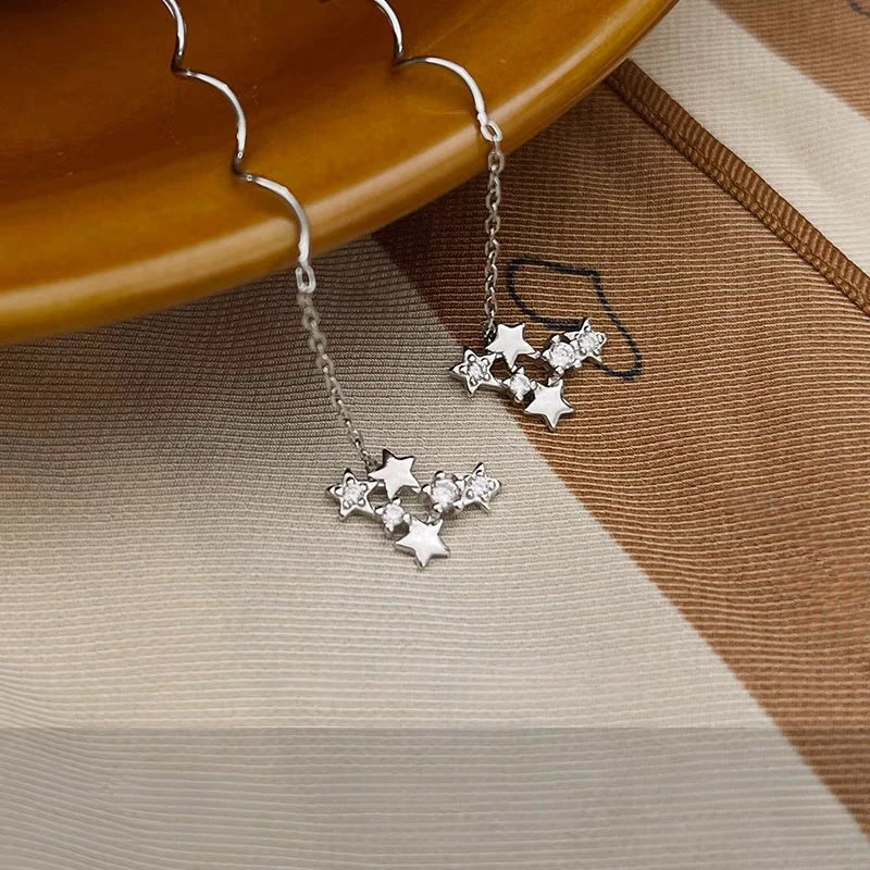 Model showcasing the dangle and style of the Sterling Silver Diamond Star Threader Earrings