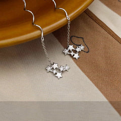 Model showcasing the dangle and style of the Sterling Silver Diamond Star Threader Earrings