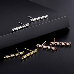Model showcasing the dangle and style of the Sterling Silver Diamond Stud Earrings