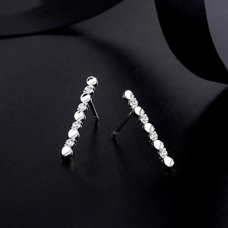 Close-up detail of the sparkling zircons and plating on the Moon and Star Earrings
