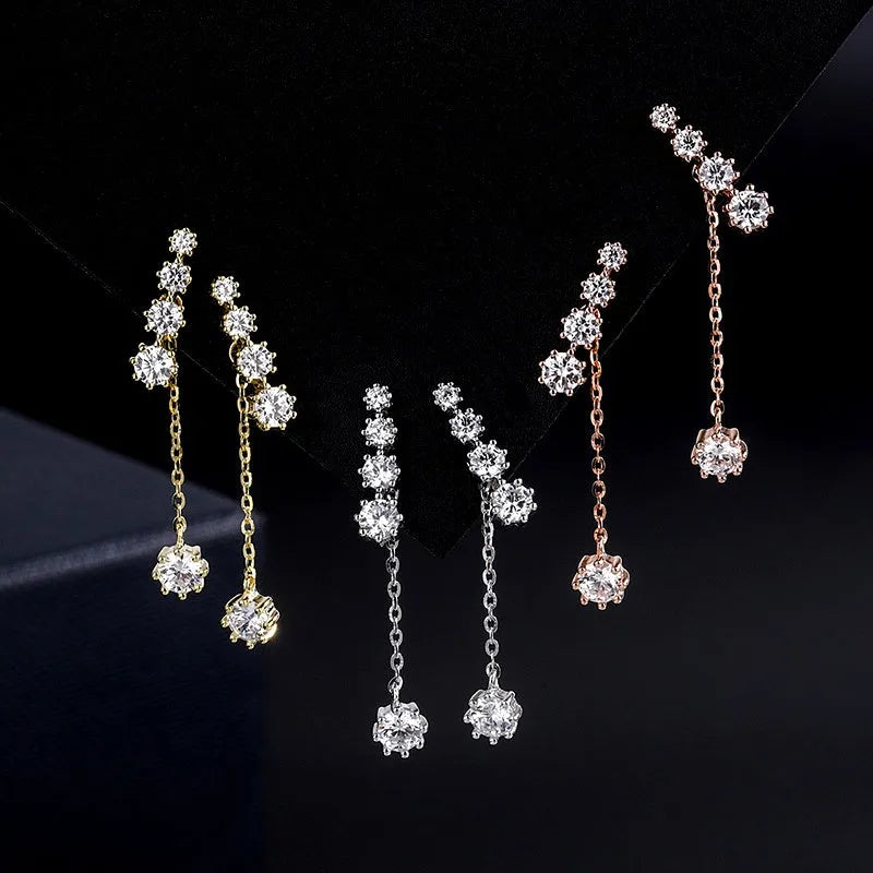 Model showcasing the dangle and style of the Sterling Silver Diamond Tassel Earrings