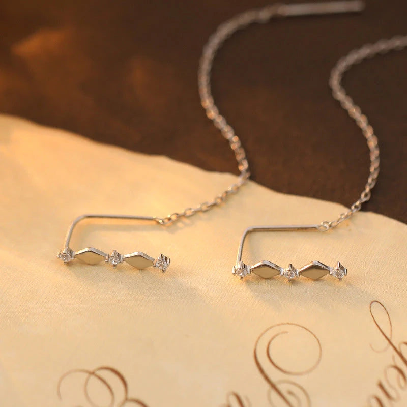 Model showcasing the dangle and style of the Sterling Silver Diamond Threader Earrings
