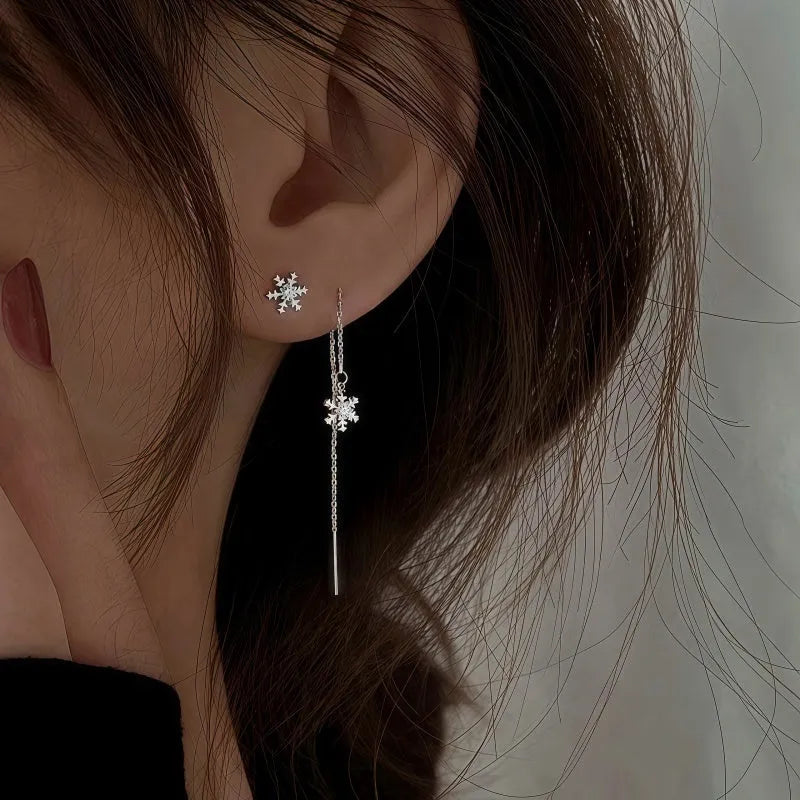 Model showcasing the dangle and style of the Sterling Silver Diamond Winter Snowflake Threader Earrings