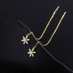 Angled view of the Sterling Silver Diamond Winter Snowflake Threader Earrings