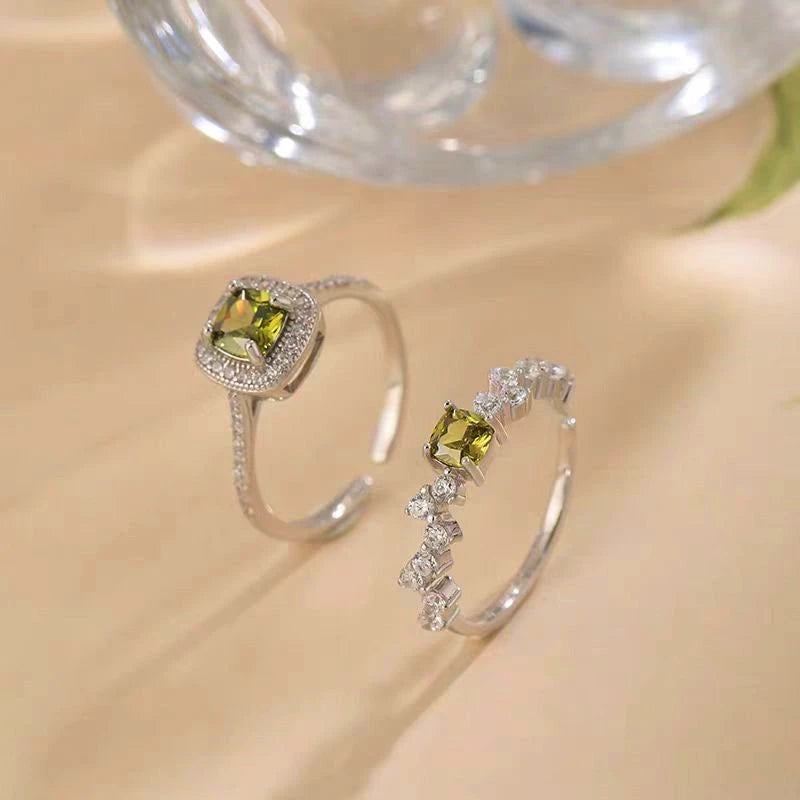 Sterling Silver Diamonds And Olive Green Zircon Rings worn on the hand to show its beautiful fit and design