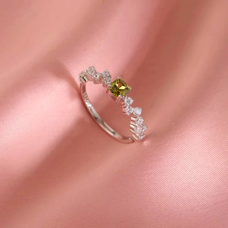 Close-up view of the gemstone and setting of the Snake Earrings