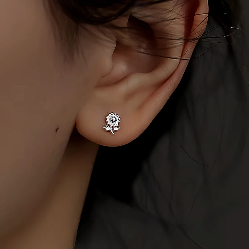 Model showcasing the dangle and style of the Sterling Silver Diasy Stud Earrings