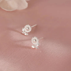 Angled view of the Sterling Silver Diasy Stud Earrings