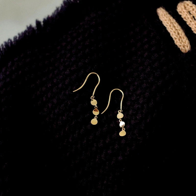 Close-up detail of the sparkling zircons and plating on the Star Threader Earrings
