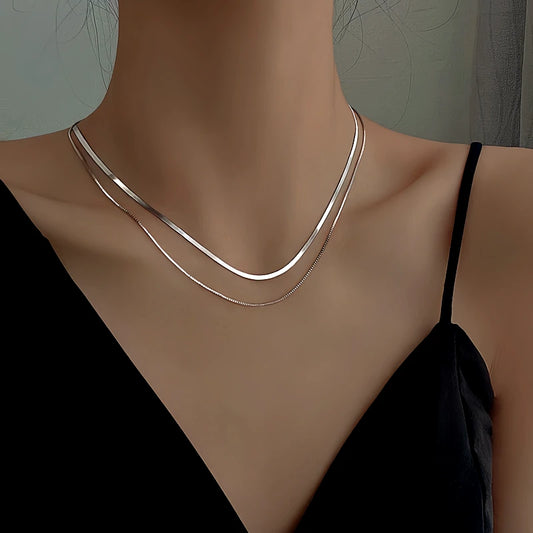 Sterling Silver Double-Layer Chain Necklace worn to showcase its length and pendant detail