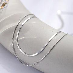 Close-up of the pendant and clasp on the Dolphin Hoop Earrings