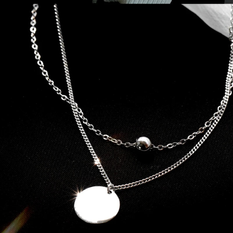 Sterling Silver Double-Layer Disc Necklace worn to showcase its length and pendant detail