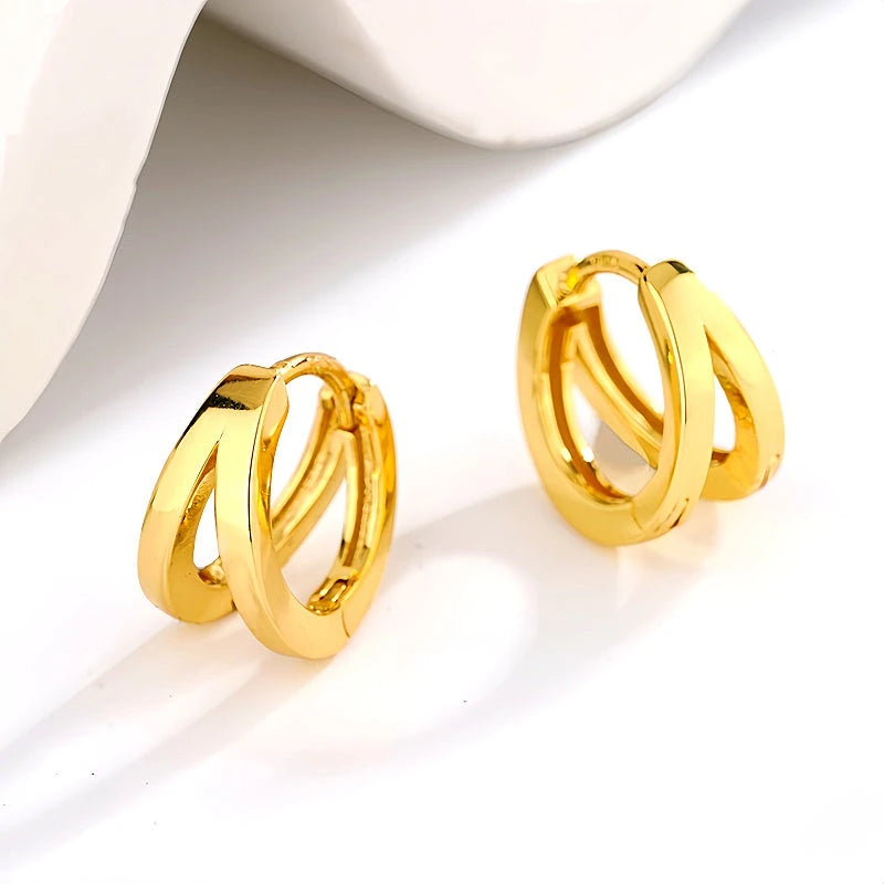 Model showcasing the dangle and style of the Sterling Silver Double-Layer Hoop Earrings