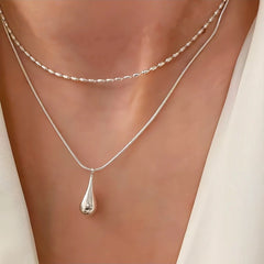 Sterling Silver Double-Layer Water Drop Necklace worn to showcase its length and pendant detail