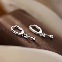 Close-up detail of the sparkling zircons and plating on the Tassel Earrings