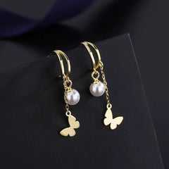 Angled view of the Sterling Silver Double Later Butterfly Pearl Earrings