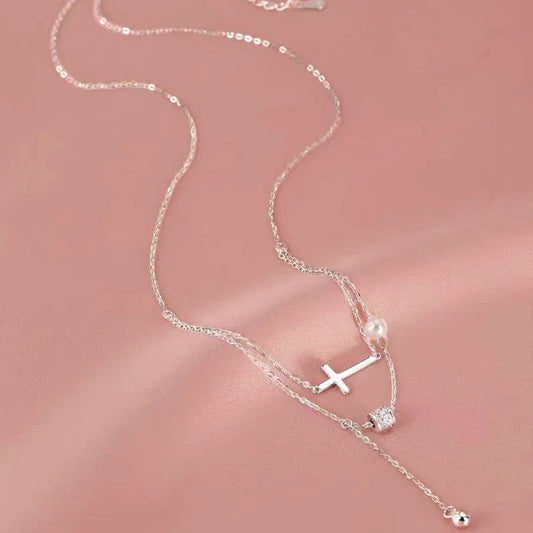 Sterling Silver Double Layer Stacked Cross Pearl Necklaces worn to showcase its length and pendant detail