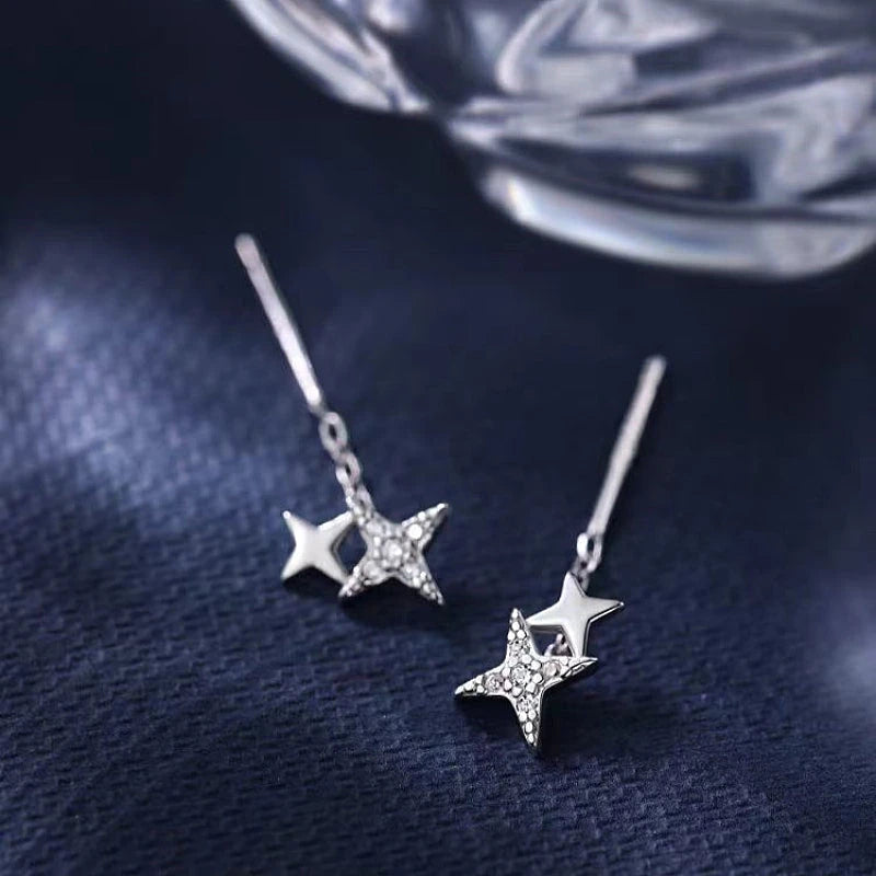 Angled view of the Sterling Silver Double Star Threader Earrings