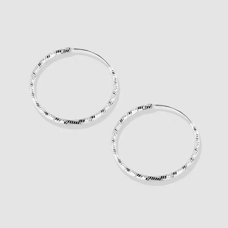 Close-up detail of the sparkling zircons and plating on the Double Star Earrings