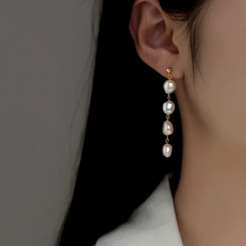 Close-up detail of the sparkling zircons and plating on the Cross Necklace