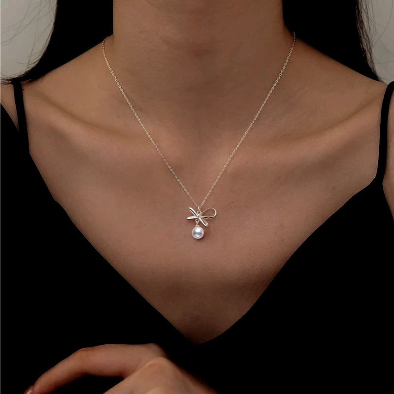 Close-up of the pendant and clasp on the Disc Necklace