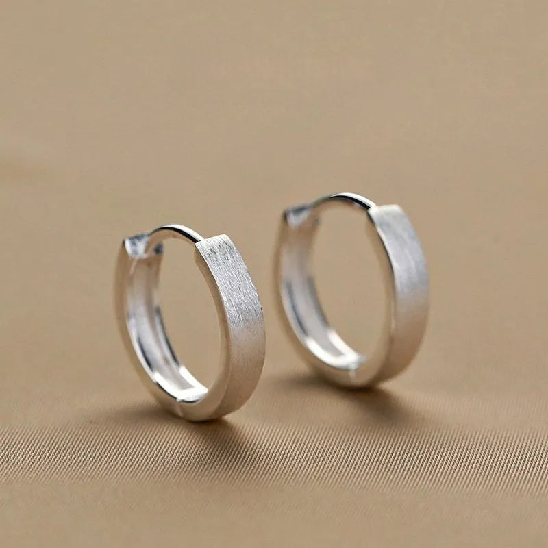 Close-up detail of the sparkling zircons and plating on the Double Hoop Earrings