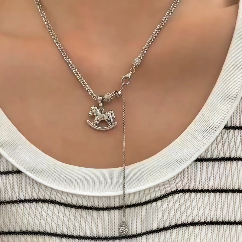 Sterling Silver Elegant Carousel Pendant Necklace worn to showcase its length and pendant detail